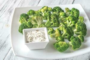 Cooked broccoli with greek yogurt photo