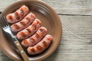 Portion of grilled sausages photo