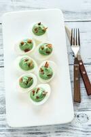 Spinach and bacon deviled eggs photo