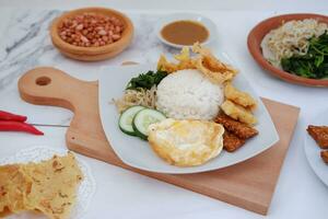 Thai food with rice, fried tofu, shrimp paste, sweet and sour sauce photo