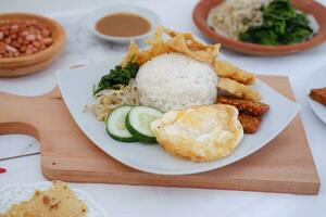 Thai food with rice, fried tofu, shrimp paste, sweet and sour sauce photo