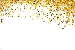 Gold confetti falling down in front of a white background photo