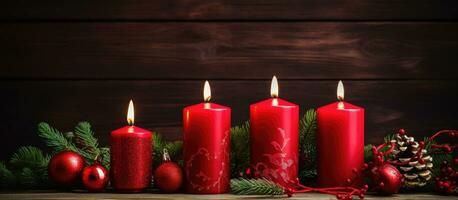 Decorative items and a quartet of crimson candles for the Advent season photo