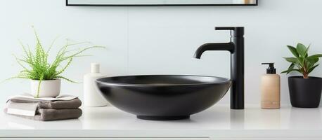 Modern bathroom with a sleek vessel sink atop a light countertop paired with a black basin mixer photo