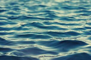 Blue water surface background photo