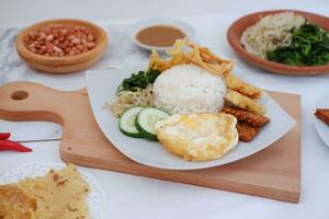 Thai food with rice, fried tofu, shrimp paste, sweet and sour sauce photo