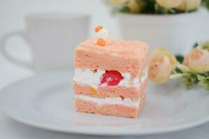 Slice of cake on white marble background. Selective focus. photo