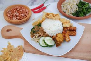 Nasi lemak, Indonesian food with rice and fried chicken photo