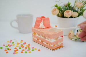 Slice of cake on white marble background. Selective focus. photo