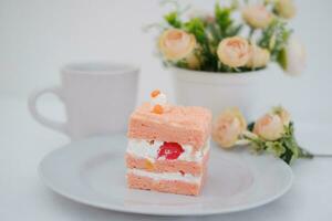 Slice of cake on white marble background. Selective focus. photo