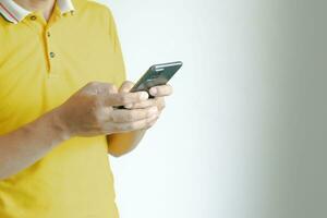 Man using mobile phone to chat with work over wireless network photo