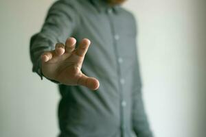 Male hand reaching out, business concept photo