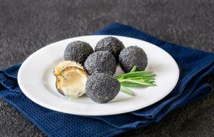 Black truffle mozzarella balls photo