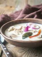 Bowl of thai tom kha kai soup photo