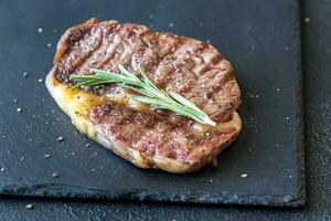 Grilled beef steak with rosemary photo