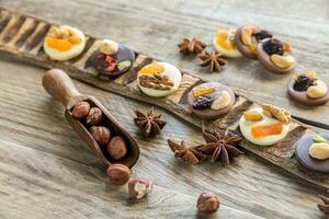 Swiss chocolate candies with nuts and dried fruits photo