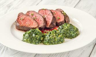 Flank steak with creamy spinach photo