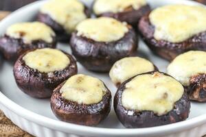 Baked mushrooms stuffed with mozzarella photo