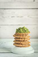 Sesame crispbread with guacamole photo