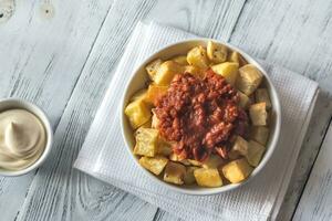 Portion of patatas bravas with sauces photo