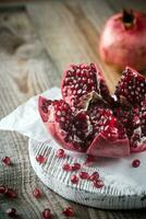 Pomegranate on the wooden board photo