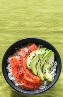 White rice with salmon and avocado photo