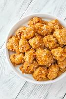 Bowl of orange chicken photo