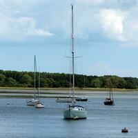 Yachts moored on a calm river photo