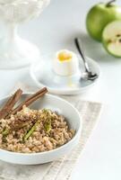 Oats with egg and green apple photo