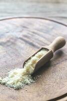 Parmesan cheese on the wooden board photo