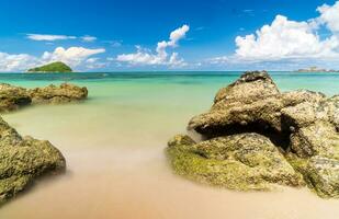 landscape view long exposure White sand beach clear blue water Nang Ram Beach, Chonburi Thailand early morning with blue sky white clouds perfect journey. On tourist travel holiday in summer of year photo