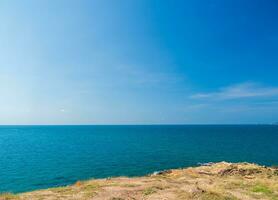 landscape view summer blue sea calm wave. wind blows cool And still see rock distance still island And sky clear look relaxed. Suitable relax travel Khao Leam Ya National Park Rayong Thailand Pacific photo