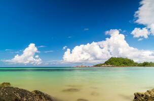 landscape view long exposure White sand beach clear blue water Nang Ram Beach, Chonburi Thailand early morning with blue sky white clouds perfect journey. On tourist travel holiday in summer of year photo