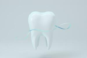 White tooth with blue gradient particles surrounded, 3d rendering. photo