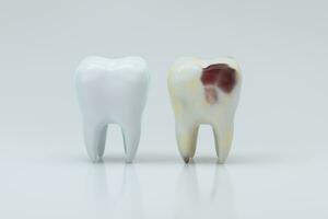 The decayed tooth beside with the white tooth, 3d rendering. photo