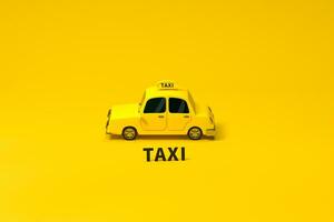 Mini 3D taxi, mini car with yellow color, 3d rendering. photo