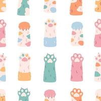 Cute colorful cats paws seamless pattern. Different funny pet paws with claws, animals hands. vector