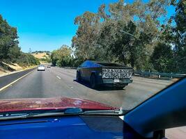 California, San Jose, USA - 08.23.2023 Tesla Cybertruck on the road between San Jose and San Francisco. photo