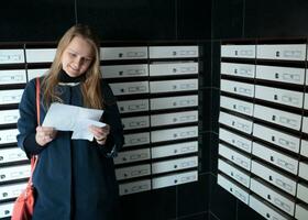 Happy woman reading a letter photo