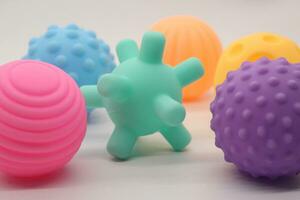 Collection of small rubber ball toys of various colors photo