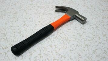 Claw hammer with black handle photo