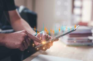 financial investment concept, businessman using smartphone  touching virtual trading graph buy and sell share in concept of investment business growth and marketing, cryptocurrency exchange platform photo