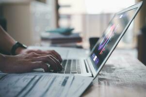 businessman typing on keyboard with virtual document data chart in Document data system Report HR technology Concept, data analysis, research and development, stock market financial investment plan photo