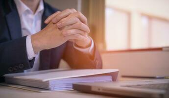 Hands of a thoughtful, hr recruiter making hiring decision at difficult job interview, opponents dialogue debate, business confrontation challenge concept, pray hope and negotiation business dealing photo