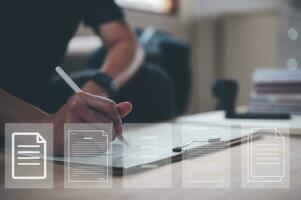 Businessman writing on notebook in office  on table with virtual document data charts. Concept of finance planing and analyzes business and growth. working from home concept. photo