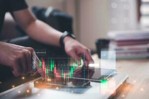 financial investment concept, businessman using smartphone  touching virtual trading graph buy and sell share in concept of investment business growth and marketing, cryptocurrency exchange platform photo