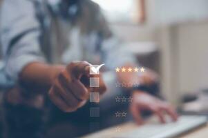 Customer service and Satisfaction concept, Business people touching the virtual screen on the 5 star icon to give satisfaction in service. rating very impressed photo