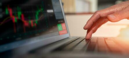 Businessman hands typing on laptop computer keyboard, surfing internet working in business concept.SEO, Search Engine Optimization, analysis financial data report, investment strategy and planning photo