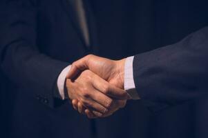 businessman shake hand with partner to celebration partnership and business deal concept, Businessman handshake for teamwork of business merger and acquisition, successful negotiate, hand shake photo