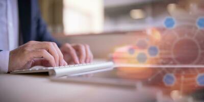 Businessman hands typing on laptop computer keyboard, surfing internet working in business concept.SEO, Search Engine Optimization, analysis financial data report, investment strategy and planning photo